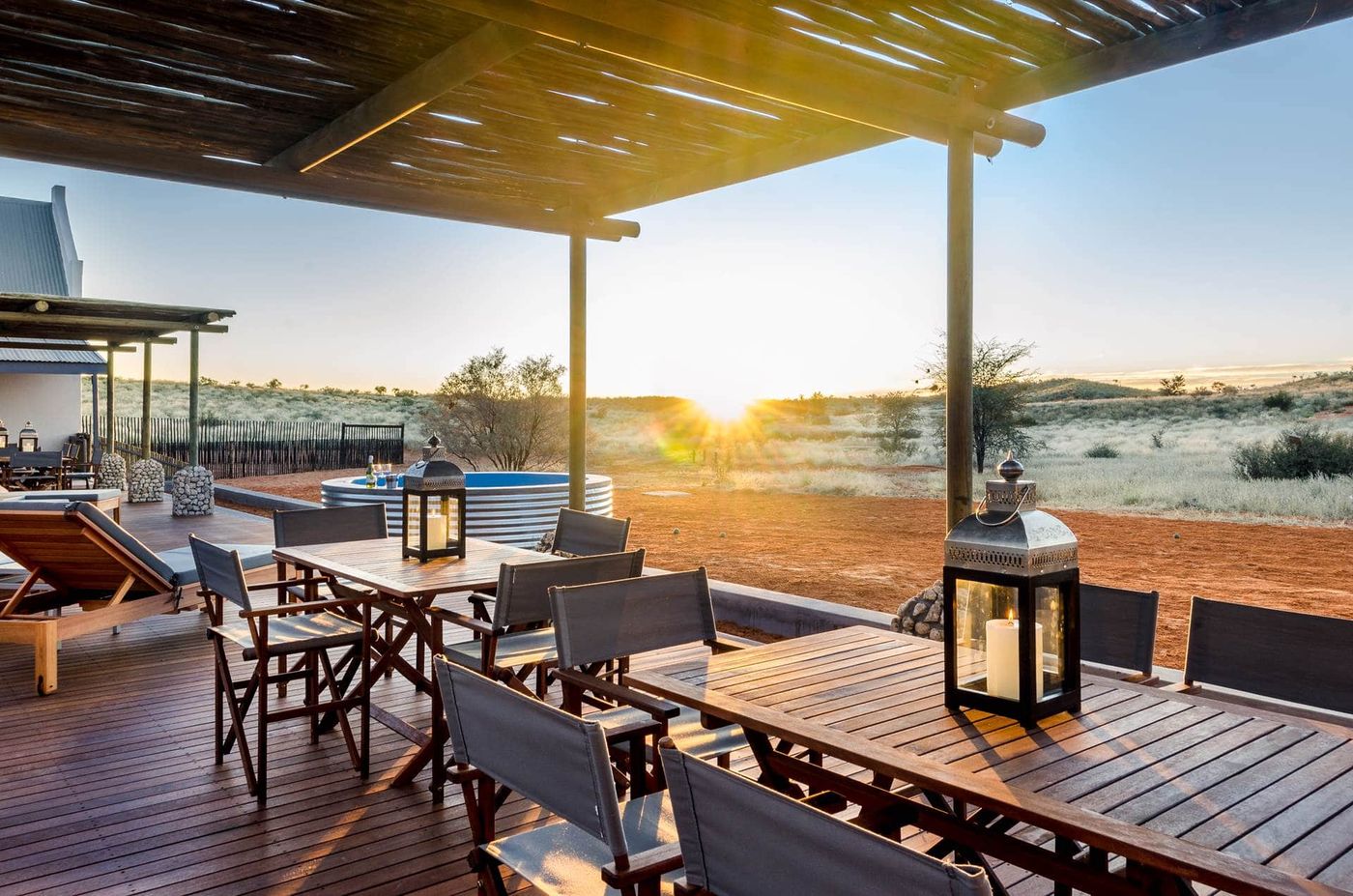 The wrap-around verandah at first light — Kalahari Farmstead & Cottage