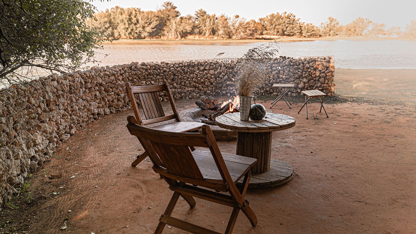 Chairs at the water — Kalahari Guesthouse & Farmstall