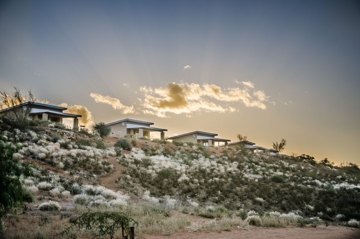 Chalets on the ridge at dusk — Kgalagadi Lifestyle Lodge